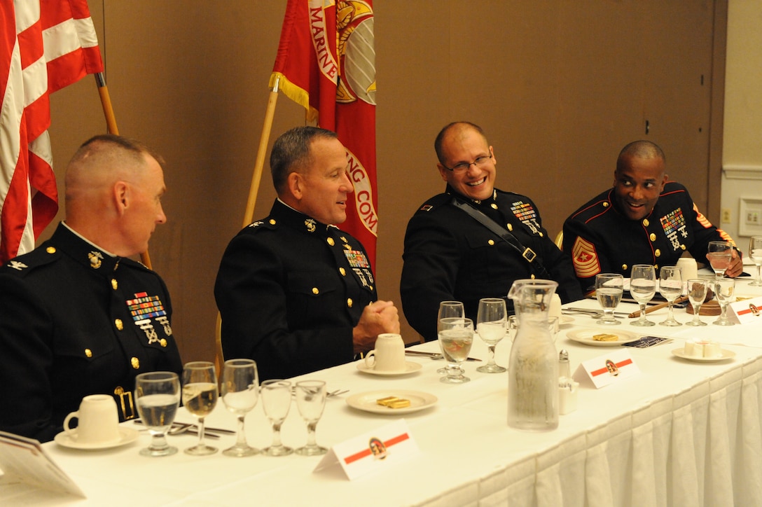 Then Maj. Gen. Robert E. Milstead Jr. (Center) sits at the Marine Corps Recruiting Command Mess Night on Oct. 7. The mess night and other family functions were a part of Lt. Gen. Milstead’s efforts to build morale and his command philosophy on treating his Marines, sailors and civilian Marines as an extended family. (U.S. Marine Corps photo by Lance Cpl. Sharon Kyle)